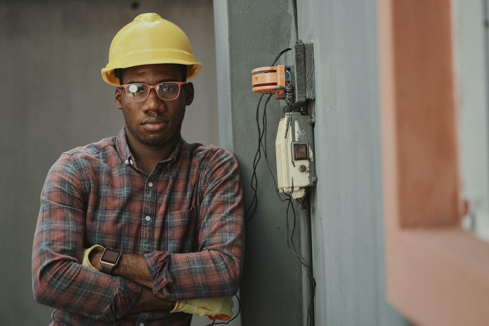 A home contractor standing by a residential electrical panel